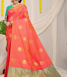 Peach banarasi silk blend saree with zari buttas & green zari border