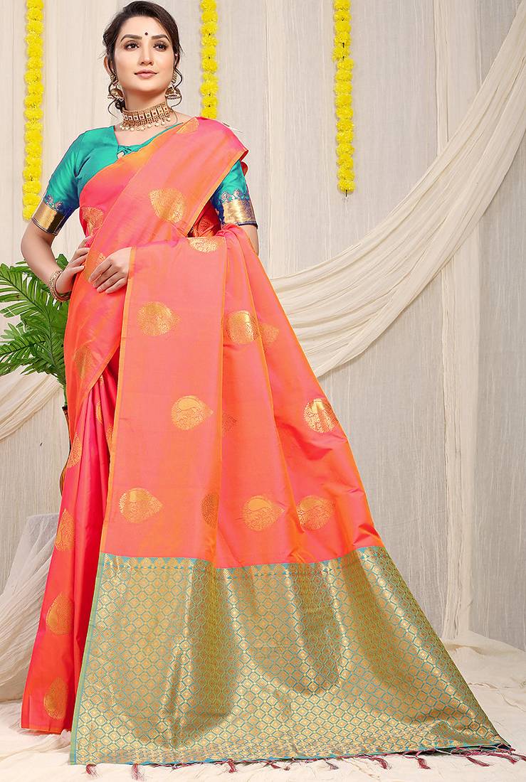 Peach banarasi silk blend saree with zari buttas & green zari border