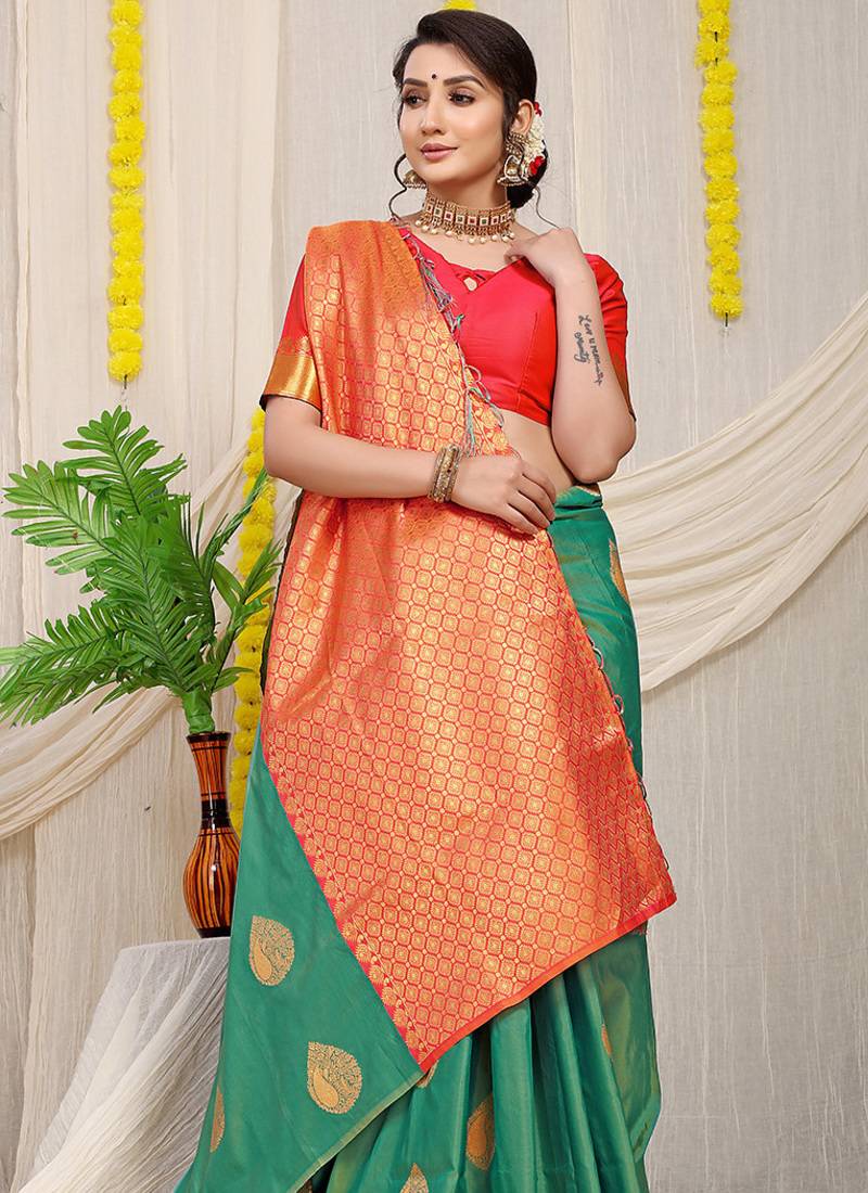 Sea green banarasi silk blend saree with zari buttas & green zari border