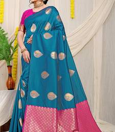 Teal blue banarasi silk blend saree with zari buttas & green zari border