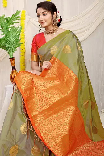 Light olive green banarasi silk blend saree with zari buttas & green zari border