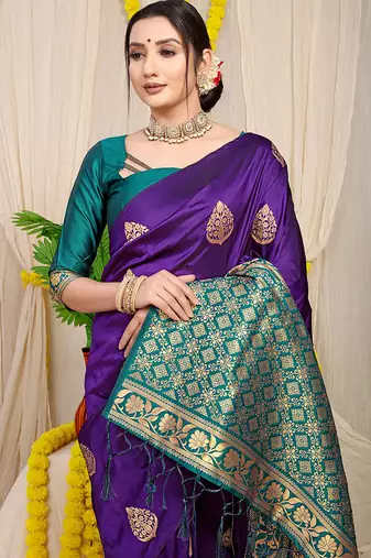 Deep violet banarasi silk blend saree with  zari butta & teal woven border