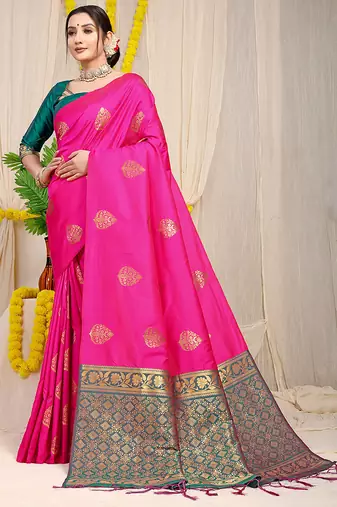 Rani pink banarasi silk blend saree with  zari butta & teal woven border