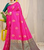 Rani pink banarasi silk blend saree with  zari butta & teal woven border
