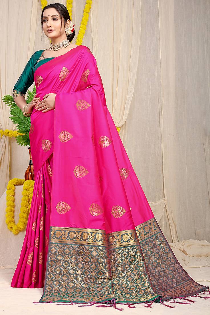 Rani pink banarasi silk blend saree with  zari butta & teal woven border