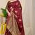 Maroon banarasi silk blend saree with  zari butta & olive green woven border