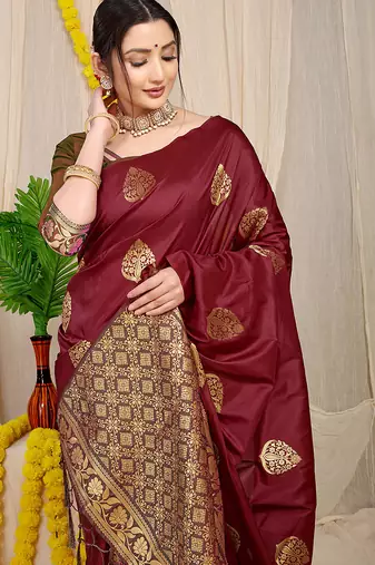 Maroon banarasi silk blend saree with  zari butta & olive green woven border