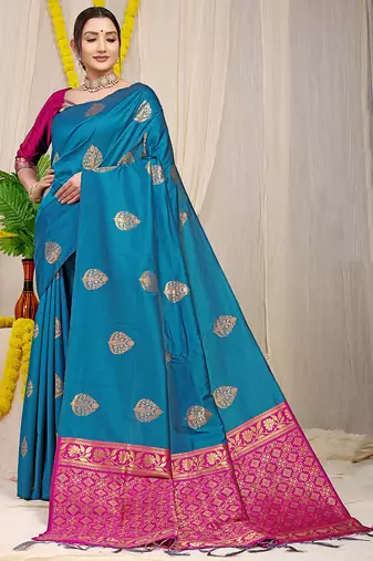 Teal blue banarasi silk blend saree with  zari butta & magenta pink woven border