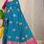 Teal blue banarasi silk blend saree with  zari butta & magenta pink woven border