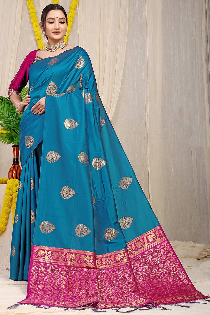 Teal blue banarasi silk blend saree with  zari butta & magenta pink woven border