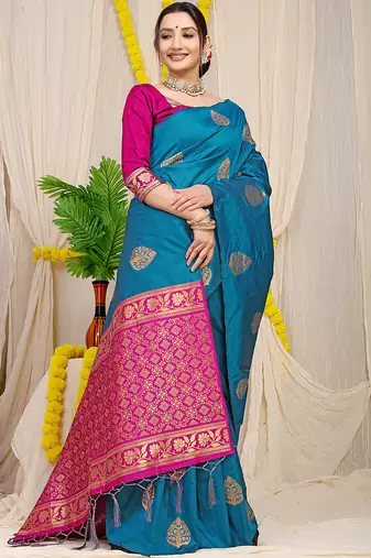 Teal blue banarasi silk blend saree with  zari butta & magenta pink woven border