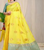 Yellow banarasi silk blend saree with  zari butta & turquoise woven border