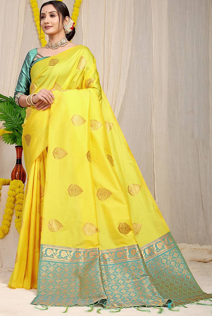 Yellow banarasi silk blend saree with  zari butta & turquoise woven border