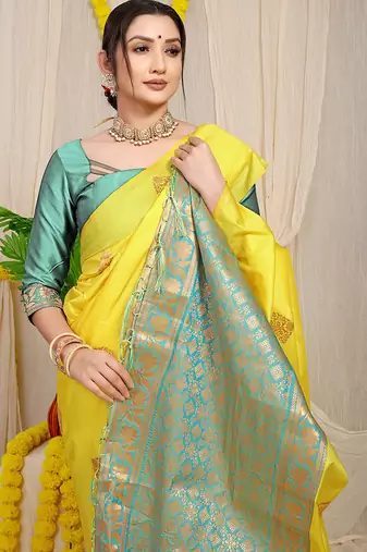 Yellow banarasi silk blend saree with  zari butta & turquoise woven border