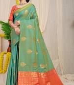 Sea green banarasi silk blend saree with  zari butta & orange woven border