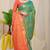 Sea green banarasi silk blend saree with  zari butta & orange woven border