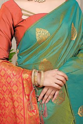 Sea green banarasi silk blend saree with  zari butta & orange woven border 4