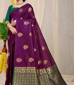 Dark purple banarasi silk blend saree with  zari butta & bottle green woven border