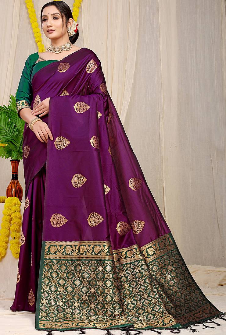 Dark purple banarasi silk blend saree with  zari butta & bottle green woven border