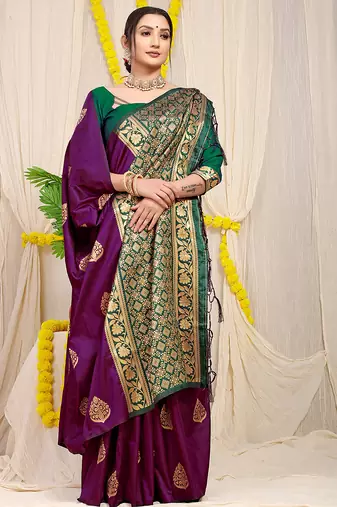 Dark purple banarasi silk blend saree with  zari butta & bottle green woven border