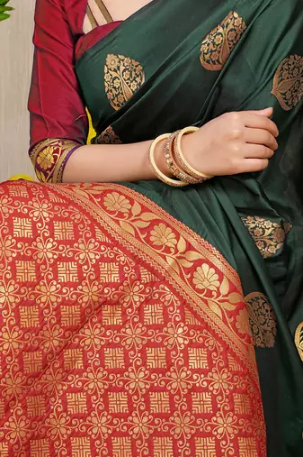 Bottle green banarasi silk blend saree with  zari butta & maroon woven border