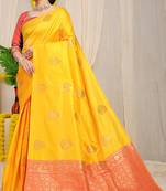 Mustard yellow banarasi silk blend saree with  zari butta & coral orange woven border