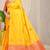 Mustard yellow banarasi silk blend saree with  zari butta & coral orange woven border