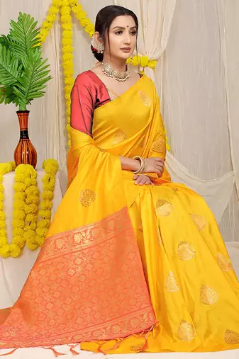 Mustard yellow banarasi silk blend saree with  zari butta & coral orange woven border