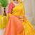 Mustard yellow banarasi silk blend saree with  zari butta & coral orange woven border