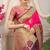 Rani pink banarasi silk blend saree with purple zari border & brocade blouse