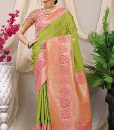 Light green banarasi silk blend saree with pink zari border & brocade blouse