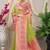 Light green banarasi silk blend saree with pink zari border & brocade blouse