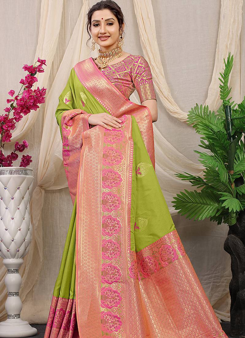 Light green banarasi silk blend saree with pink zari border & brocade blouse