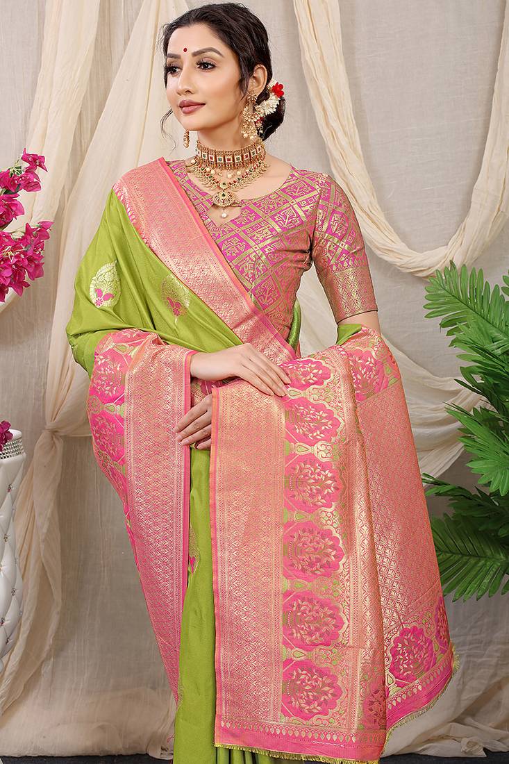 Light green banarasi silk blend saree with pink zari border & brocade blouse