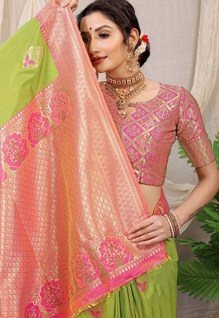 Light green banarasi silk blend saree with pink zari border & brocade blouse