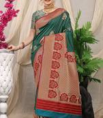 Teal banarasi silk blend saree with red zari border & brocade blouse