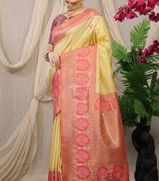 Light yellow banarasi silk blend saree with pink zari border & brocade blouse