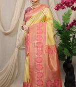 Light yellow banarasi silk blend saree with pink zari border & brocade blouse