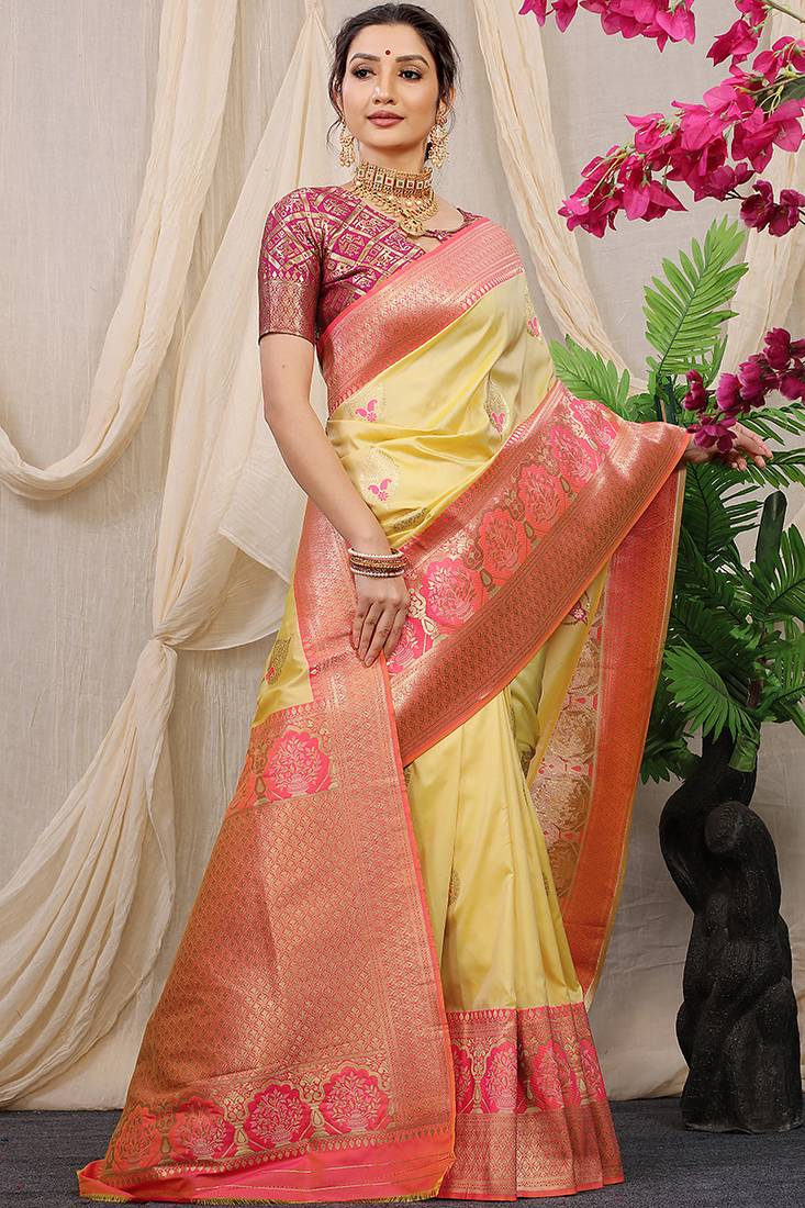 Light yellow banarasi silk blend saree with pink zari border & brocade blouse
