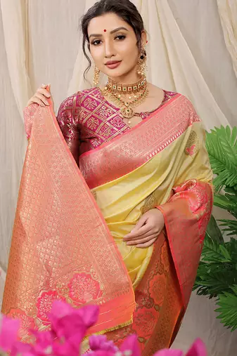 Light yellow banarasi silk blend saree with pink zari border & brocade blouse