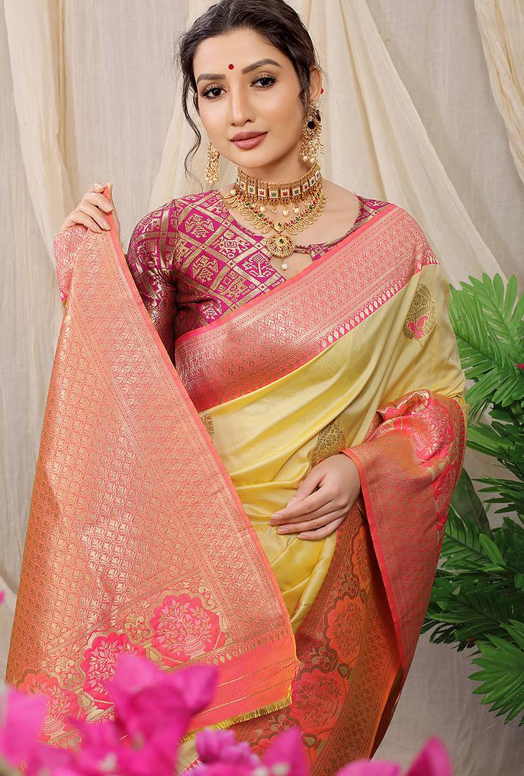 Light yellow banarasi silk blend saree with pink zari border & brocade blouse