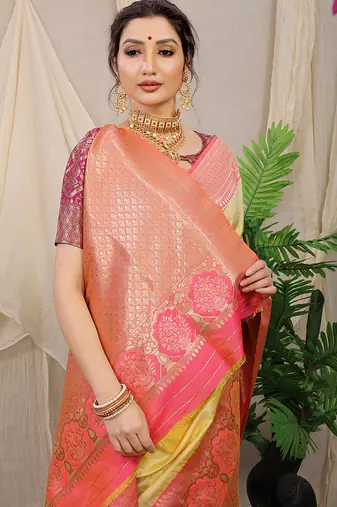 Light yellow banarasi silk blend saree with pink zari border & brocade blouse