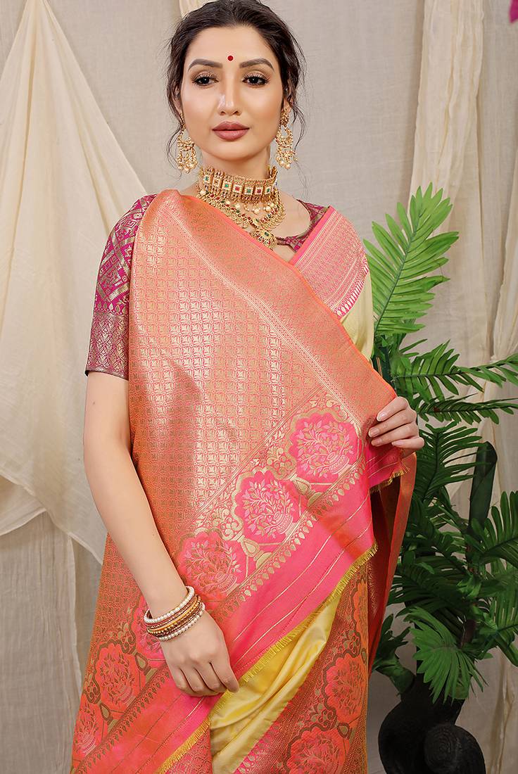 Light yellow banarasi silk blend saree with pink zari border & brocade blouse