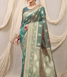 Sea green banarasi silk blend saree with rich zari woven border