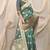 Sea green banarasi silk blend saree with rich zari woven border