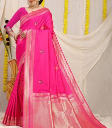 Rani pink banarasi silk blend saree with zari border & woven buti design