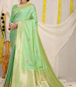 Light green banarasi silk blend saree with zari border & woven buti design