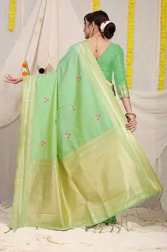 Light green banarasi silk blend saree with zari border & woven buti design