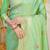Light green banarasi silk blend saree with zari border & woven buti design