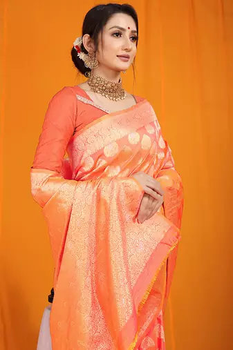 Peach banarasi silk blend saree with rich gold zari weaving & brocade pallu
